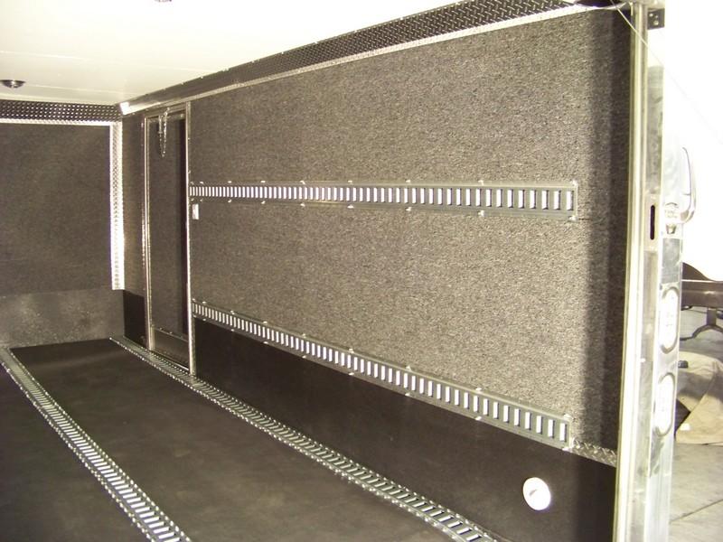 Carpeted iinterior with E-track and Line-X. 